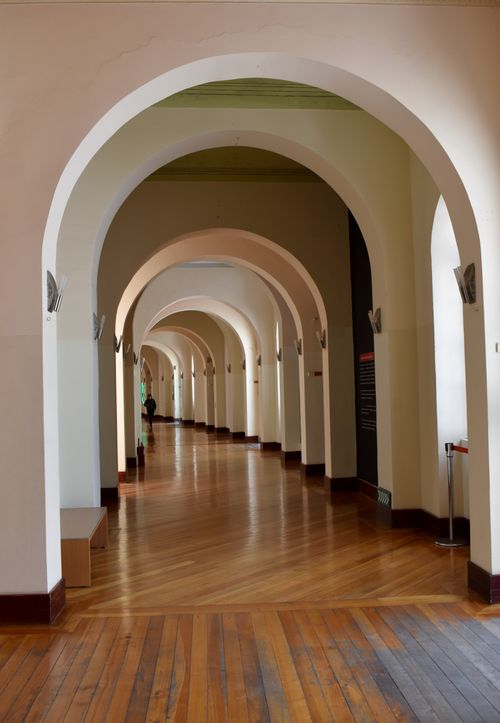 Free Charming arched corridor in Quito, showcasing architectural elegance and depth. Stock Photo