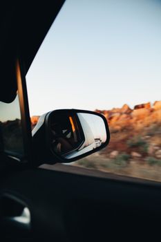 Capturing the scenic view from a side mirror, showcasing the vibrant landscape of Mardin, Turkey.