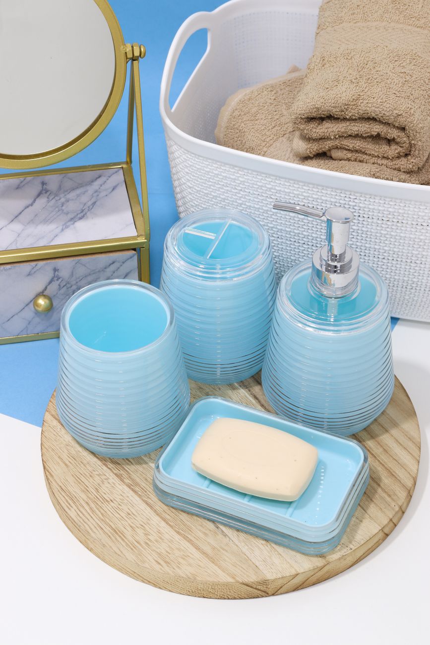 Stylish setup of blue bathroom accessories on a wooden tray.