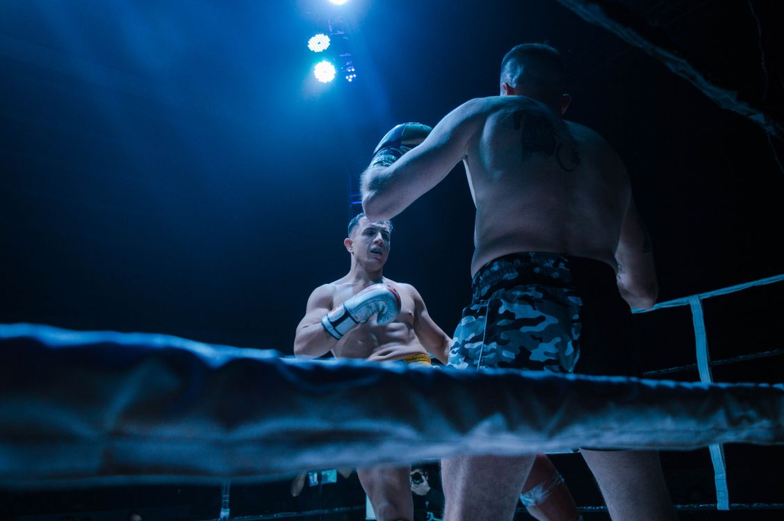 Low Angle Shot of Boxers Fighting on the Ring · Free Stock Photo