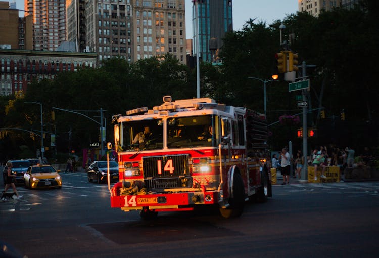 A Firetruck On The Street During Sunset