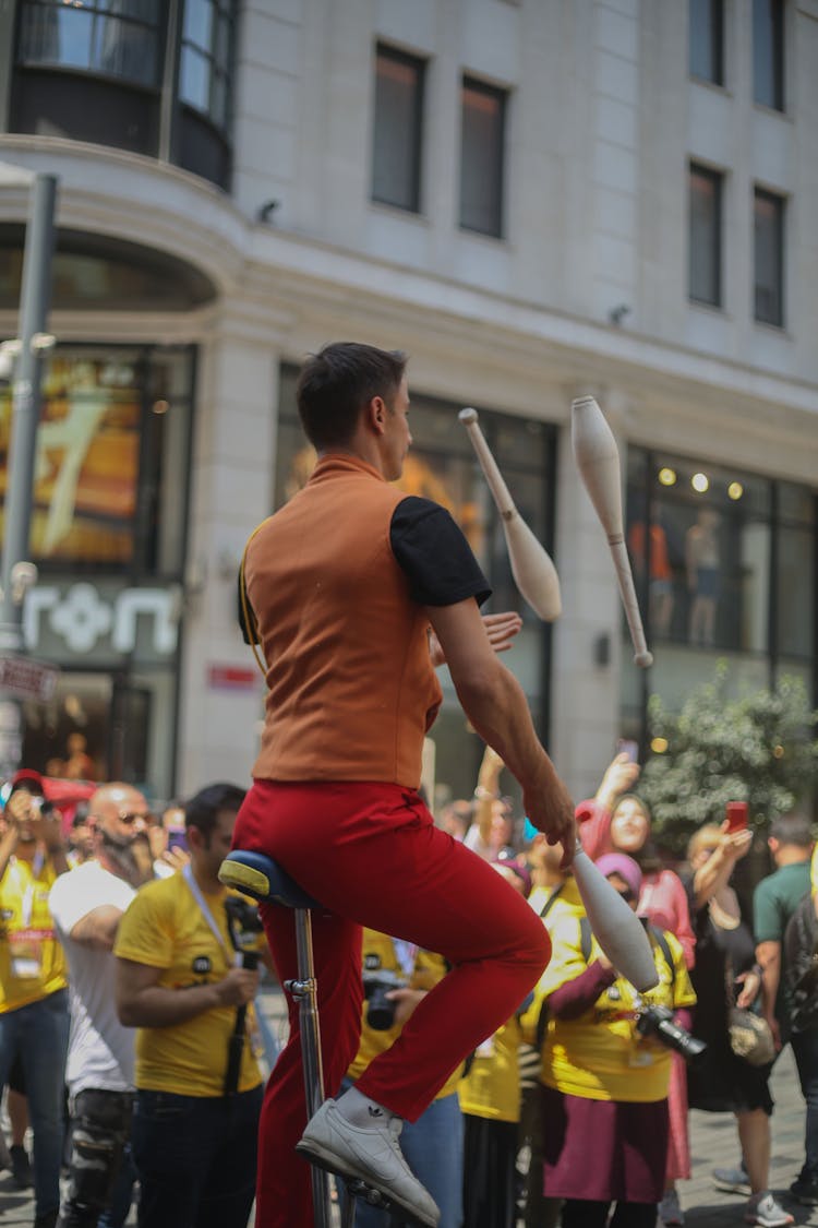 Man Riding A Unicycle On The Street