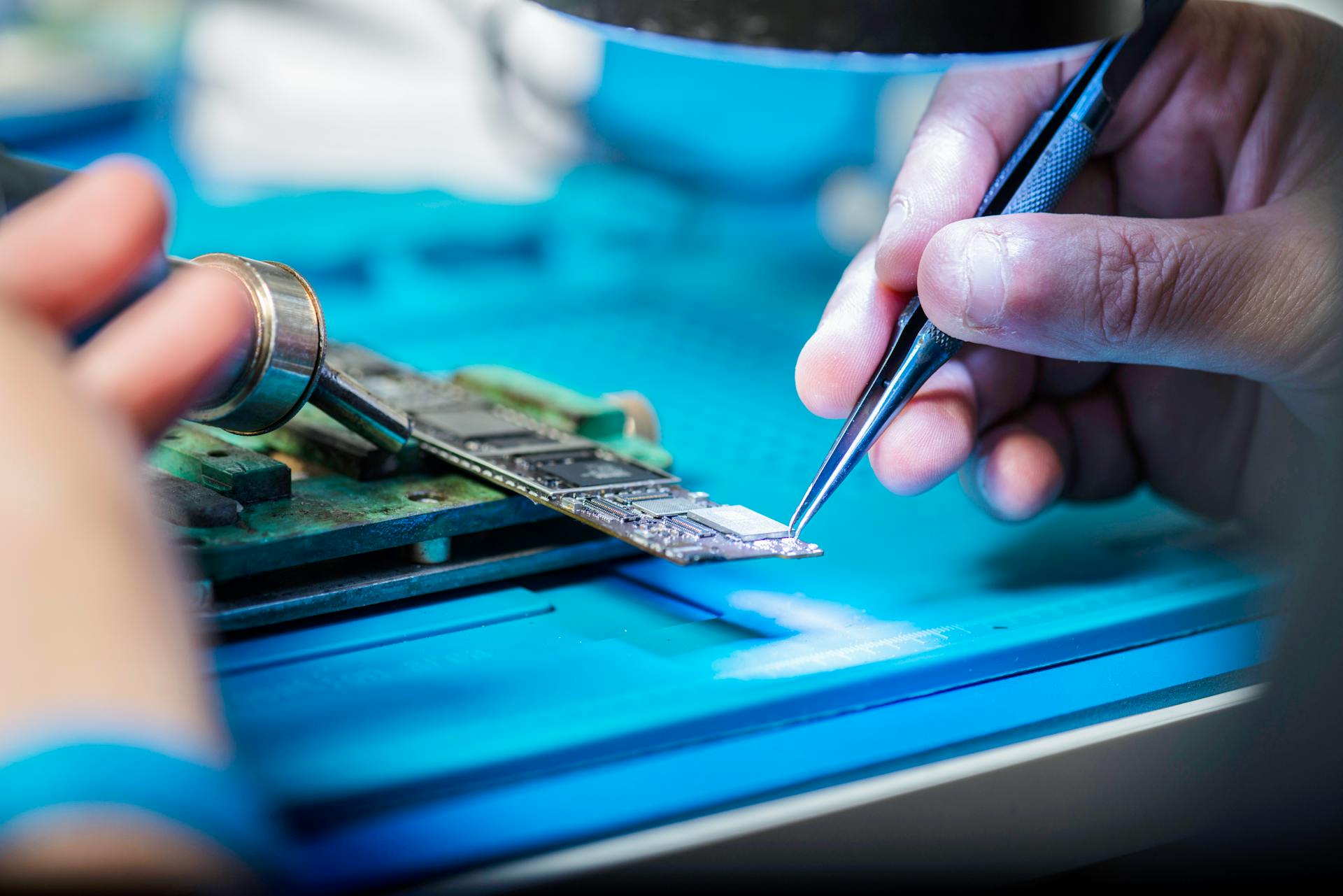 Man Hands Working on Computer Hardware