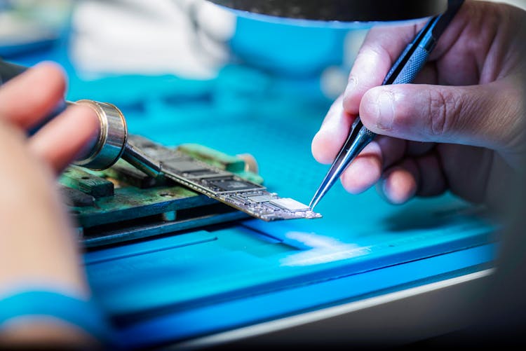 Man Hands Working On Computer Hardware