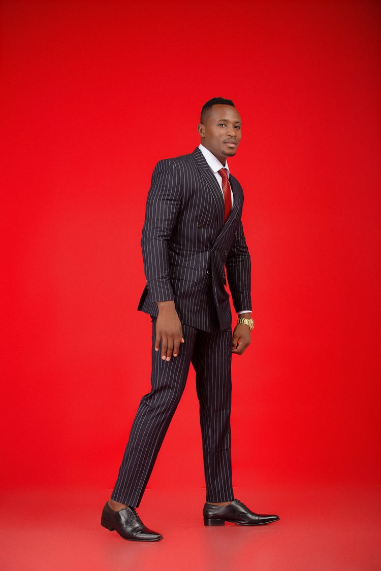 Man In Suit Posing In Studio