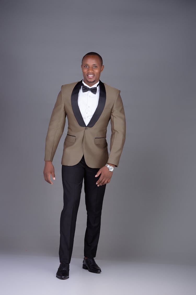 Man In Elegant Suit Posing In Studio