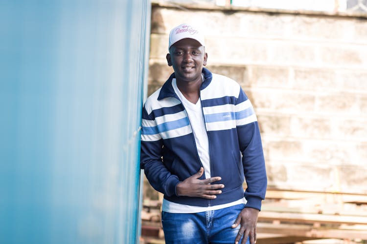 Man Wearing A Blue Striped Jacket