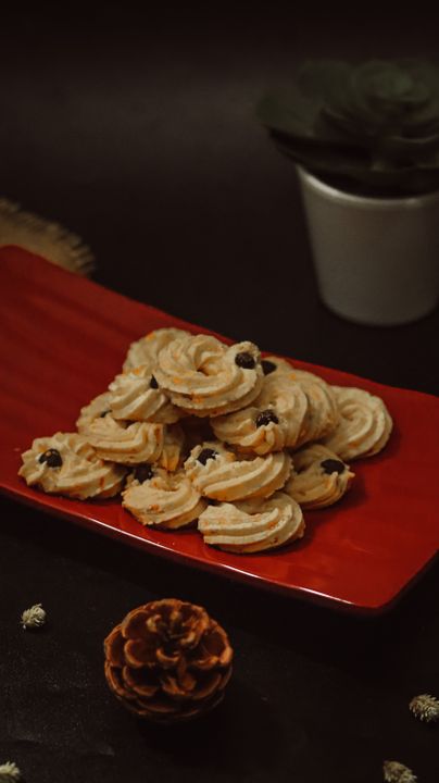 How to Make Perfect Butter Cookies: Professional Recipe and Technique 2 Butter cookies cooling on a baking tray arranged on a plate, showing finished bakery-style presentation.