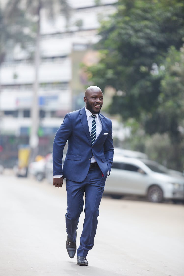 Smiling Man In Suit Walking On Street