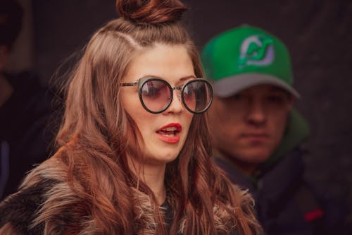 Free Woman in Black Framed Eyeglasses and Blue Cap Stock Photo