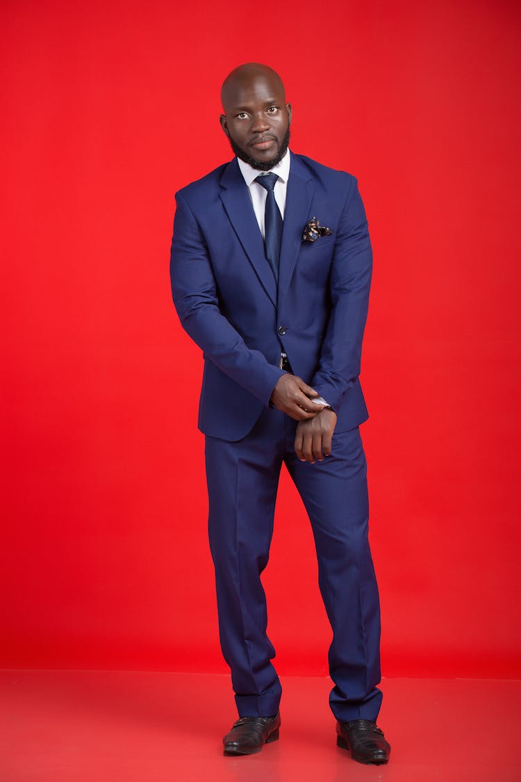 Man In Suit Posing In Studio