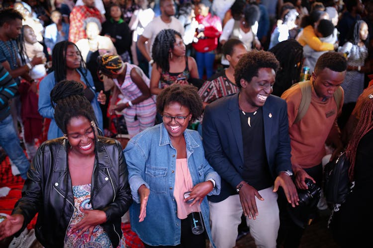 Smiling Group Of People Dancing Among The Crowd