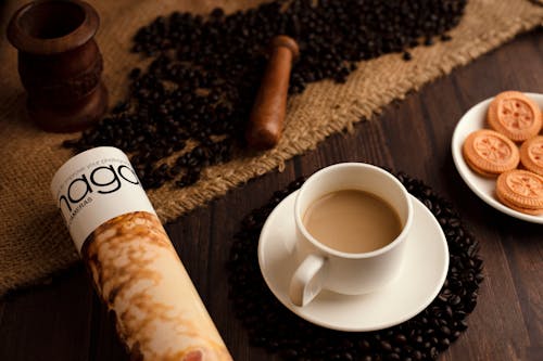 Cup of Coffee and Biscuits on Wooden Table
