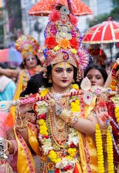 Vibrant festival parade in Bangladesh featuring participants in elaborate Krishna costumes celebrating Hindu culture.