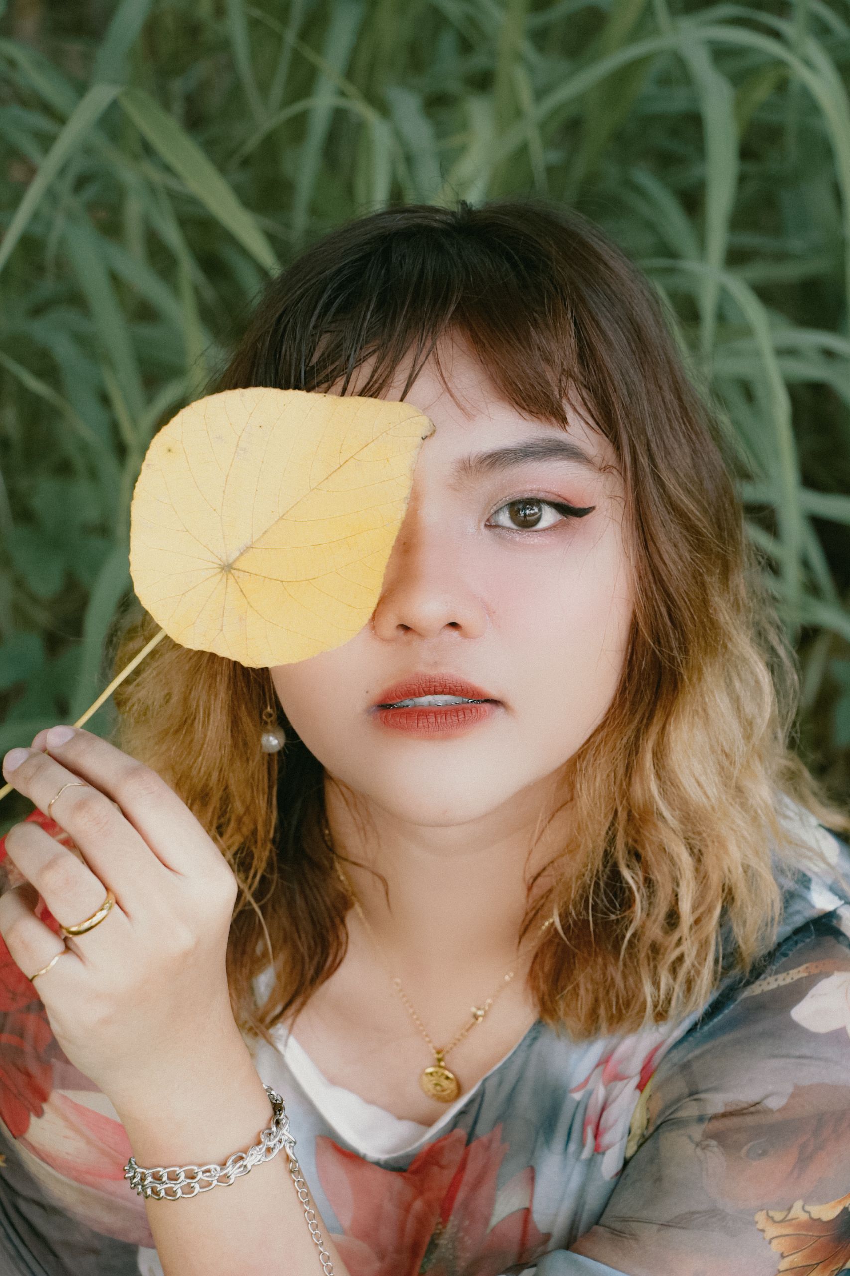 Woman Cover Her Eye with a Yellow Leaf · Free Stock Photo