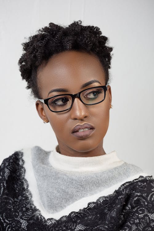 Free Woman in Afro Hair Wearing Black Eyeglasses Close-up Photo Stock Photo