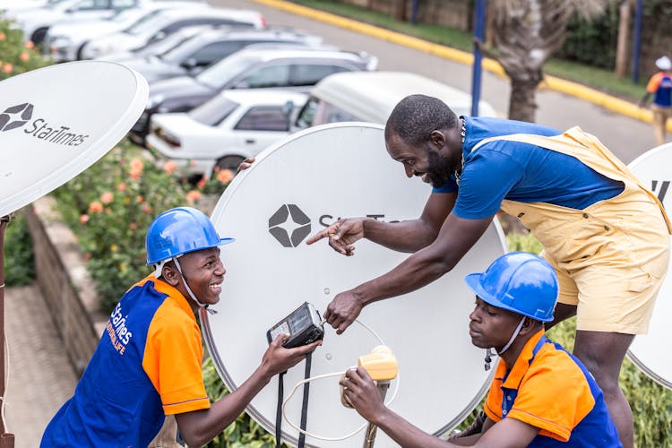 Workers Working With Antenna