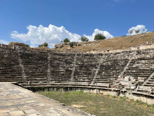 Free Explore the ancient amphitheatre ruins in Aydın, Turkey under a sunny sky. Stock Photo