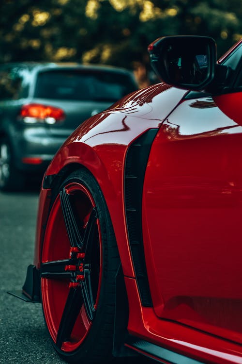 Red Car on Gray Asphalt Road