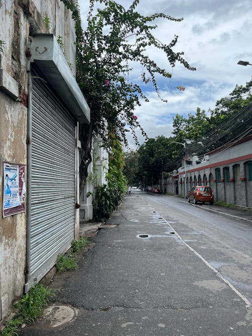 Empty Street Between Concrete Buildings · Free Stock Photo