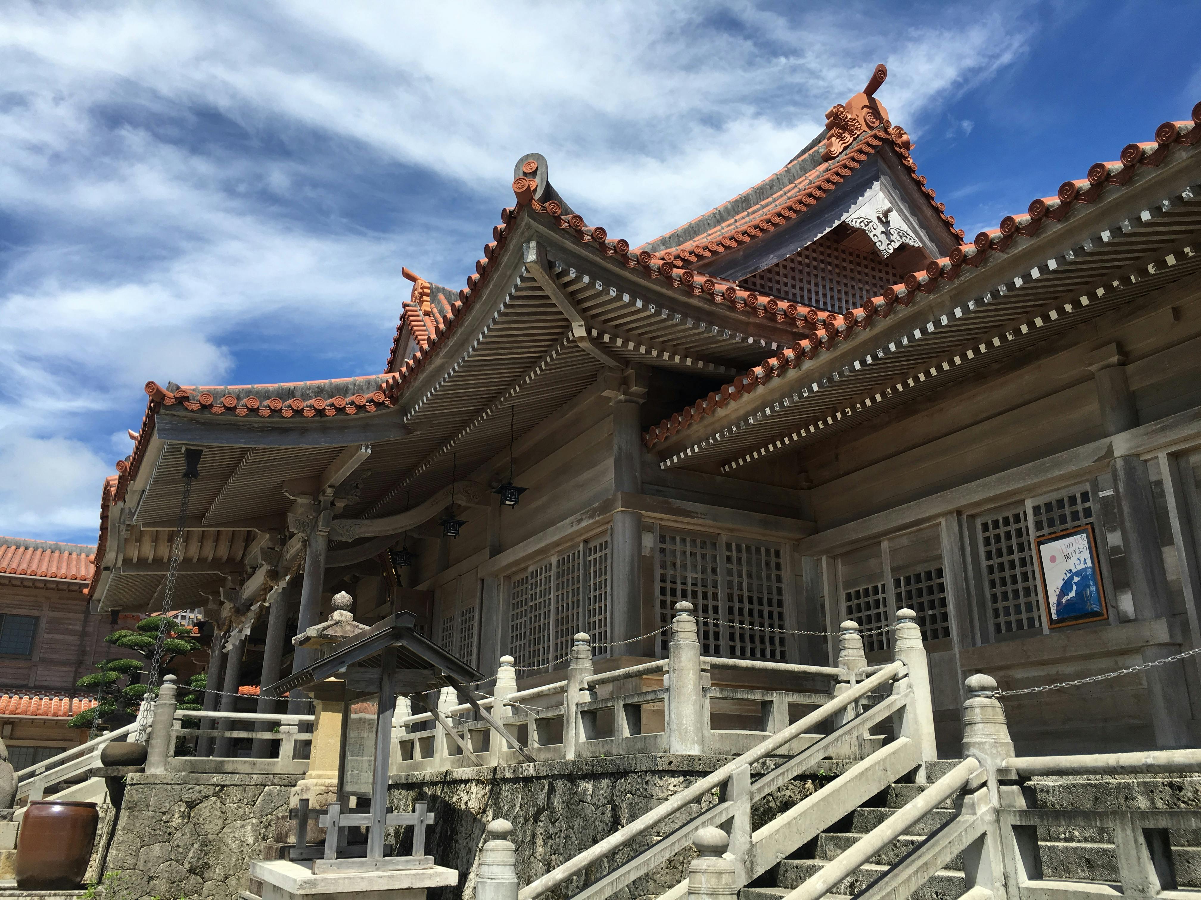 Explore a stunning Shinto shrine with intricate architecture in Ginowan, Okinawa.