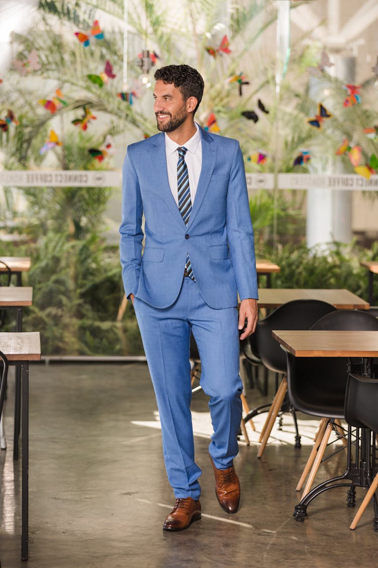 Handsome Man In Blue Suit Walking In The Coffee Shop