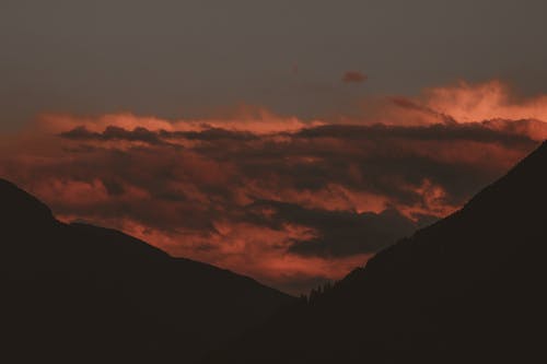 Kostnadsfri bild av bakgrundsbelyst, berg, gryning