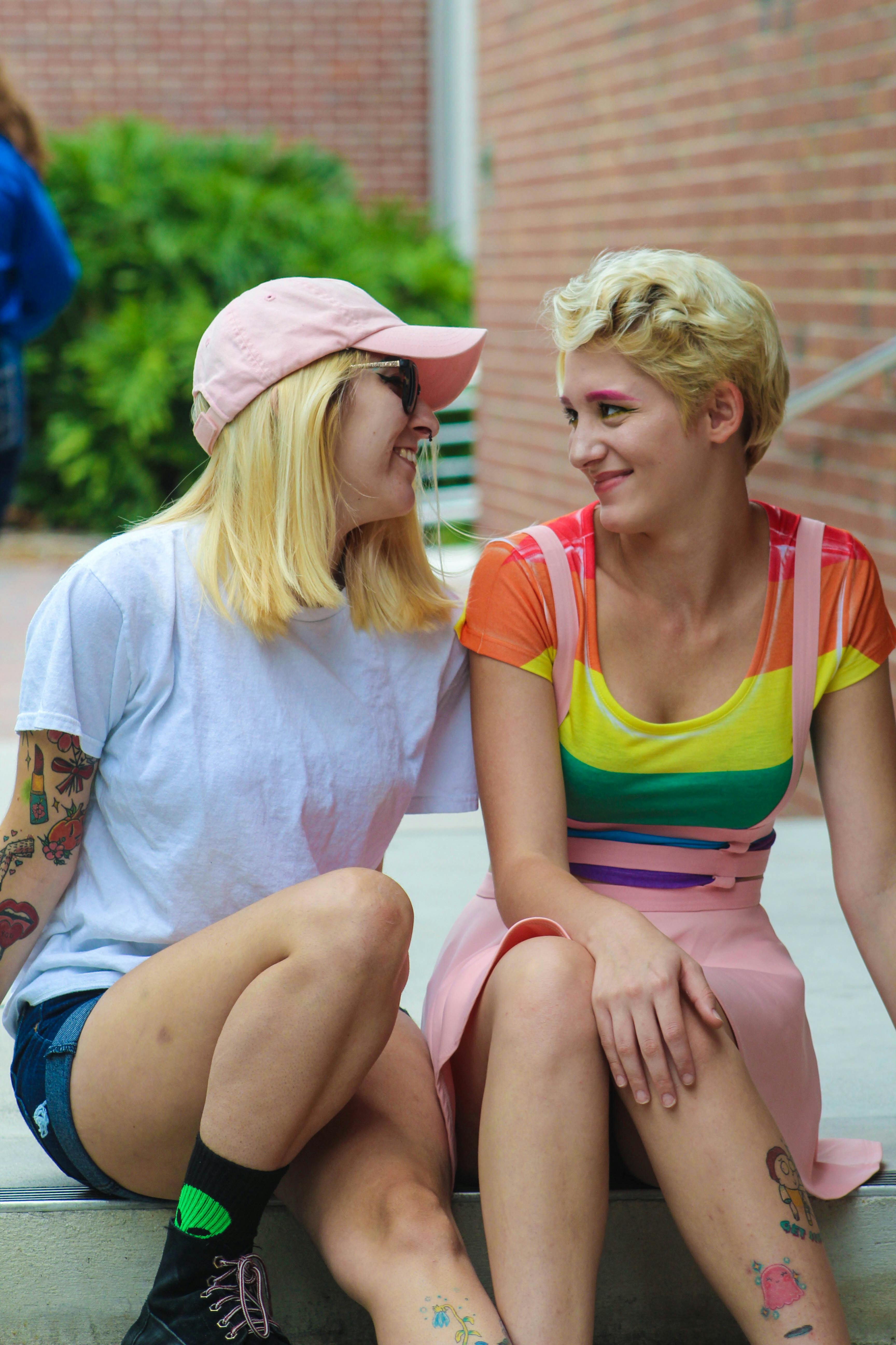 Two Women Sitting While Talking Each Other