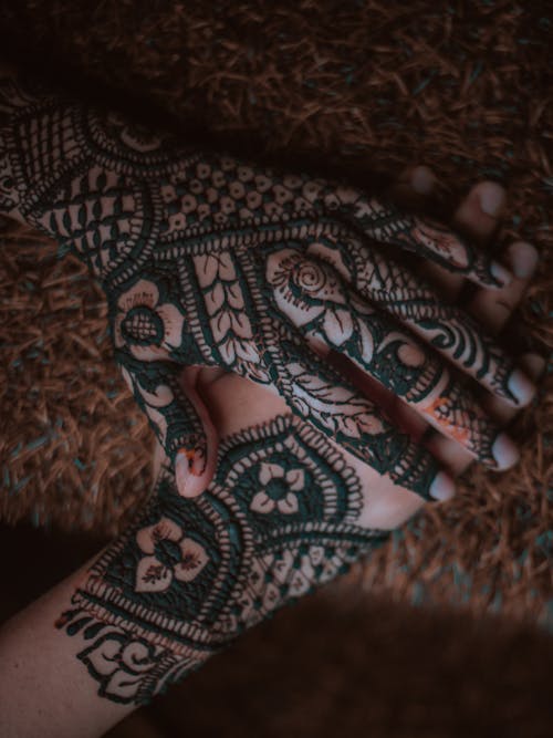 Free Hands Decorated with Tattoos Stock Photo