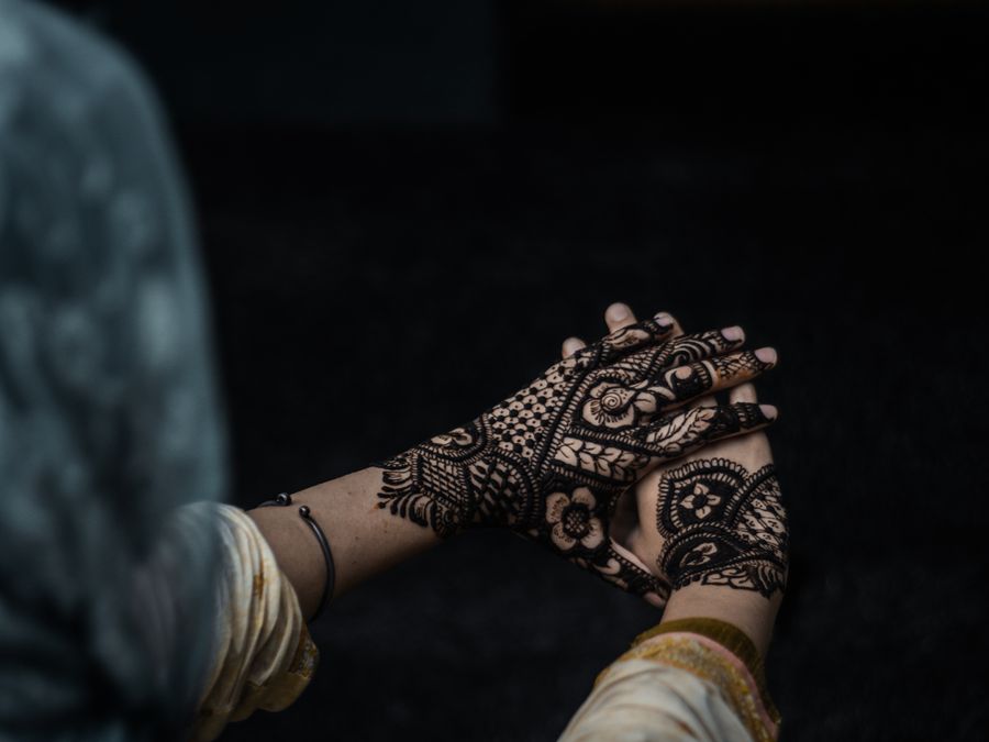 Detailed bridal mehndi henna design on a hand