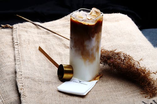 Glass of Cold Drink on a Table Mat