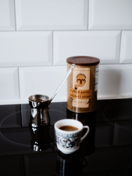 Free A stylish Turkish coffee setup with a cezve and decorated cup, ideal for morning rituals. Stock Photo