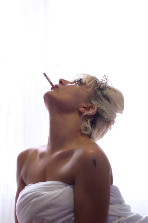 Woman Smoking While Looking Up