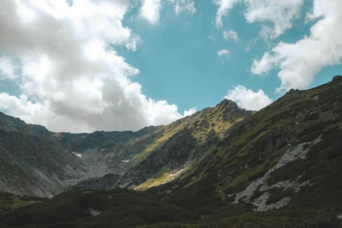 Green and Gray Mountain Under the Sky