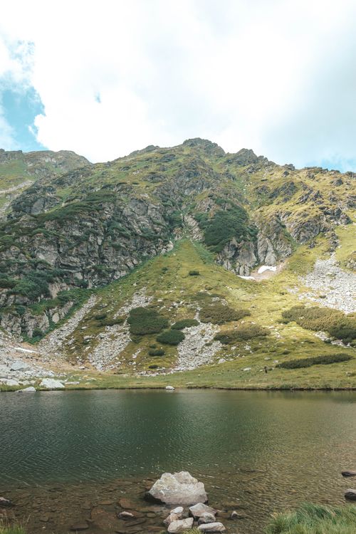 Free Serene view of a mountain landscape and tranquil lake in Romania. Stock Photo