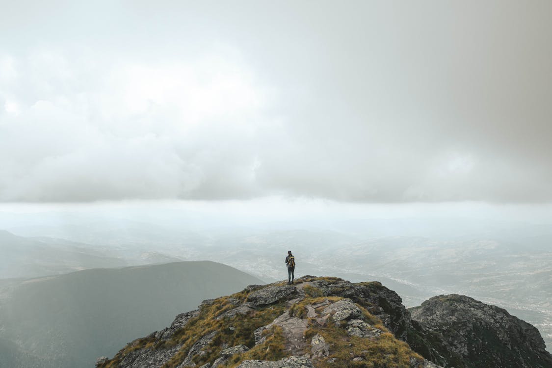 Person Standing on the Mountain