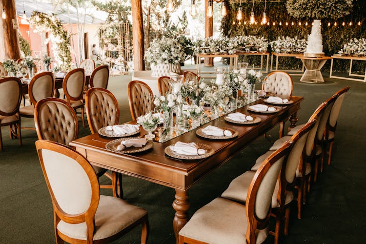 Wedding Venue With Table Setting And White Flowers