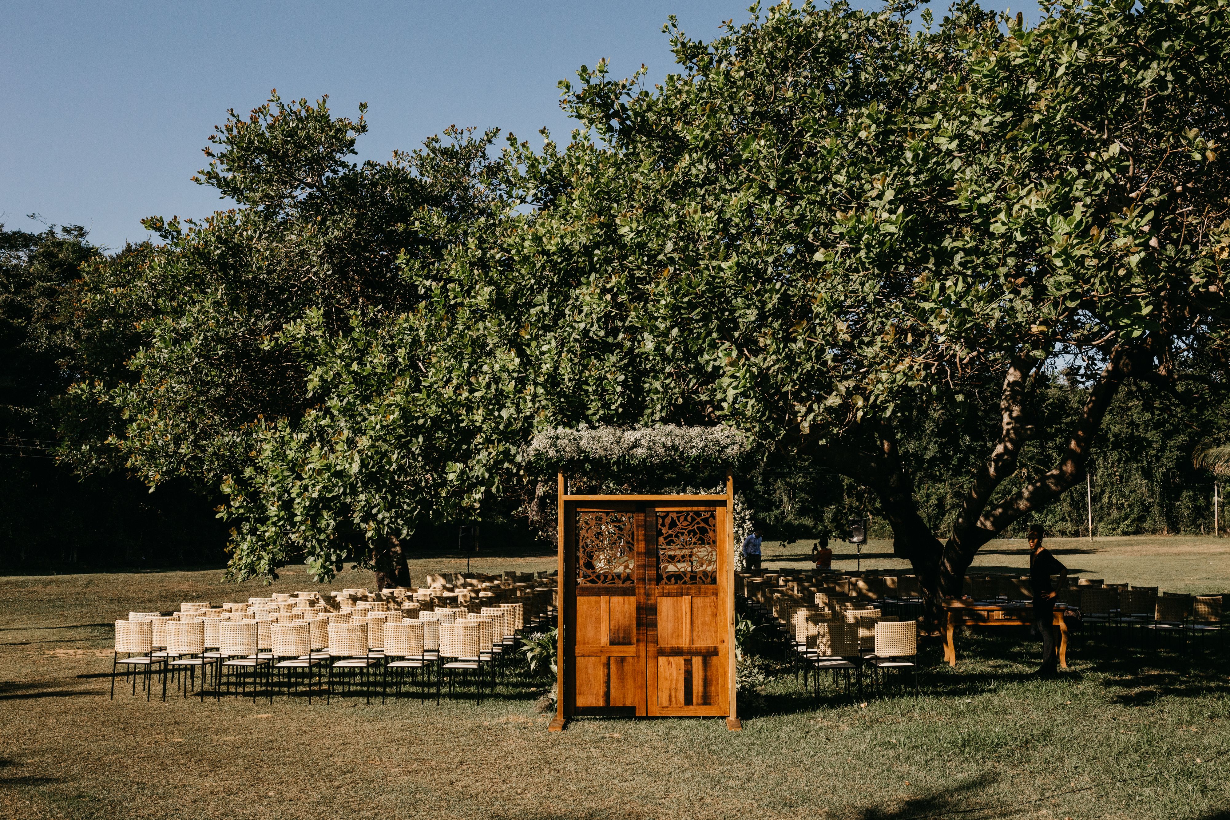 Intimate wedding ceremony arbor with subtle blue floral accents