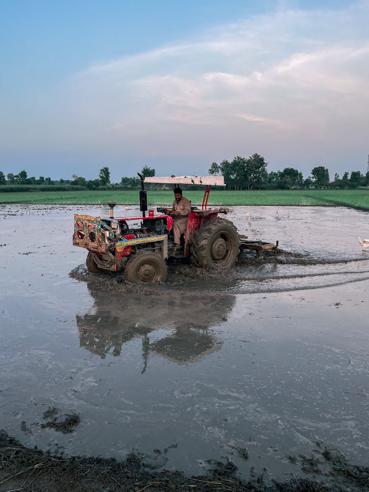 Photo Of A Tractor In A Mud