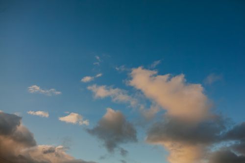 Free A stunning image of a vibrant blue sky filled with dramatic clouds during the daytime. Stock Photo