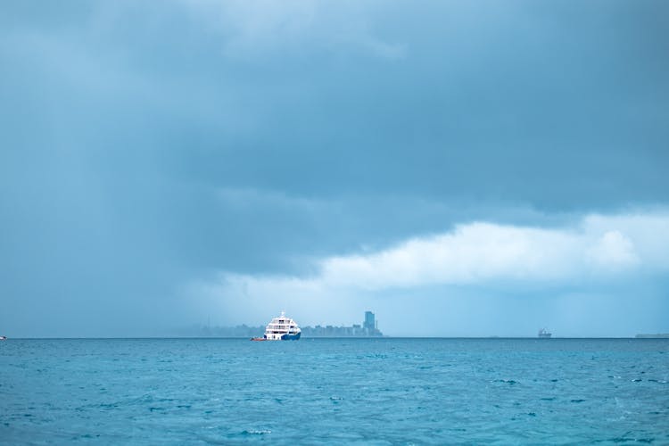 White Ship On Sea Under White Clouds