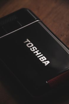 Detailed view of a black digital device, showcasing sleek design and technology.