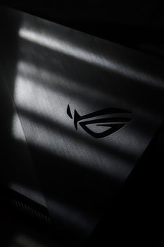 A monochrome photo of the Republic of Gamers logo with dramatic light and shadow effects. 12877878