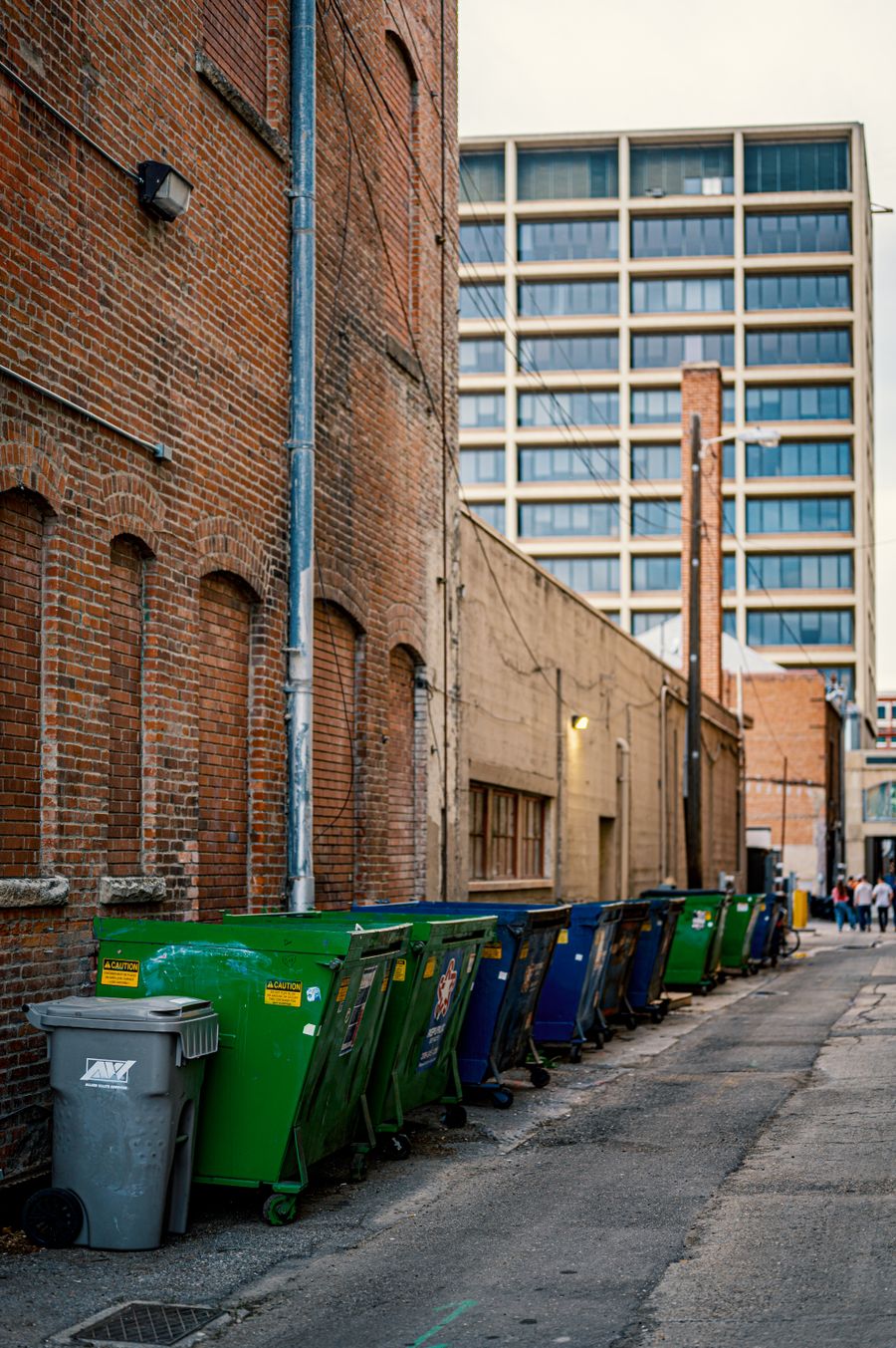 Industrial waste containers staged for collection