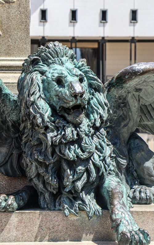 Weathered Sculpture of a Winged Lion