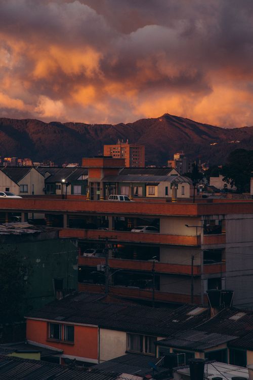 Cloudy Sky over a City at Sunset · Free Stock Photo