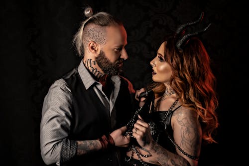 Tattooed Couple in Costumes 