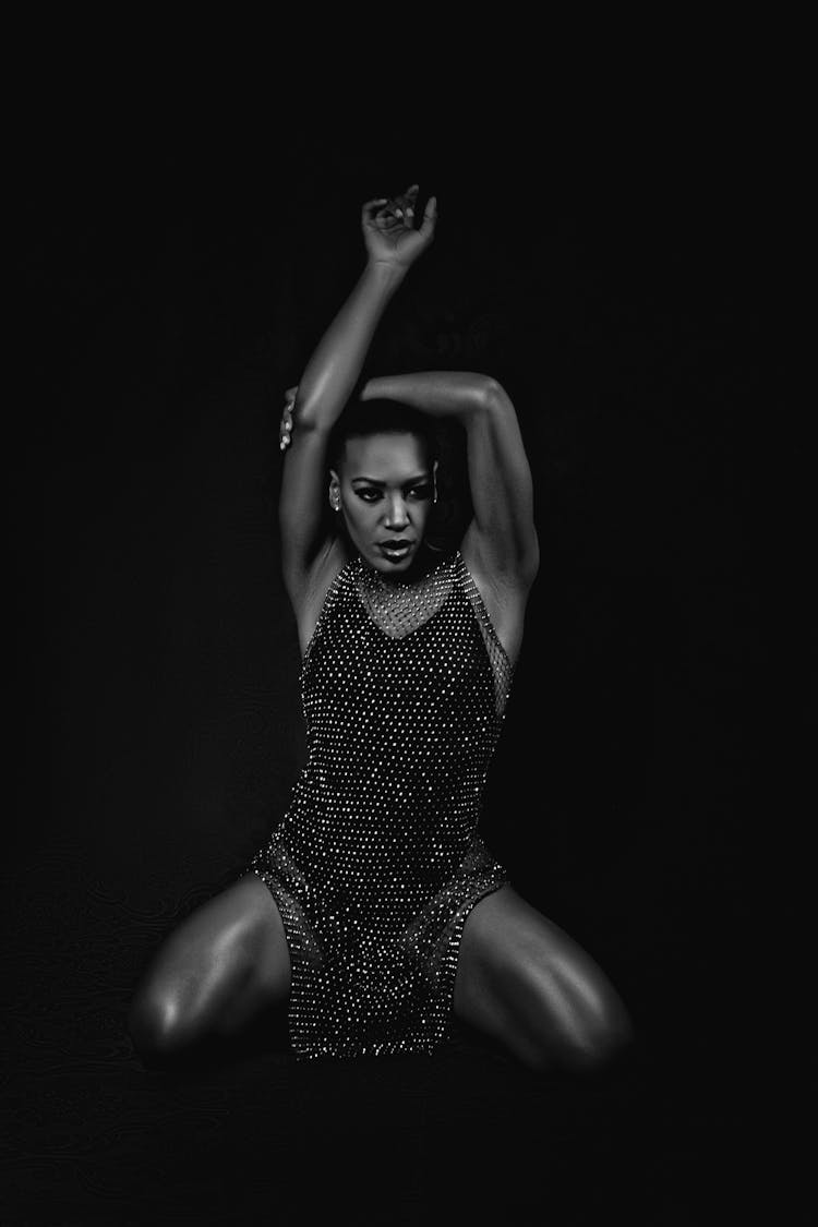 Grayscale Photo Of A Woman In Glittery Dress Posing