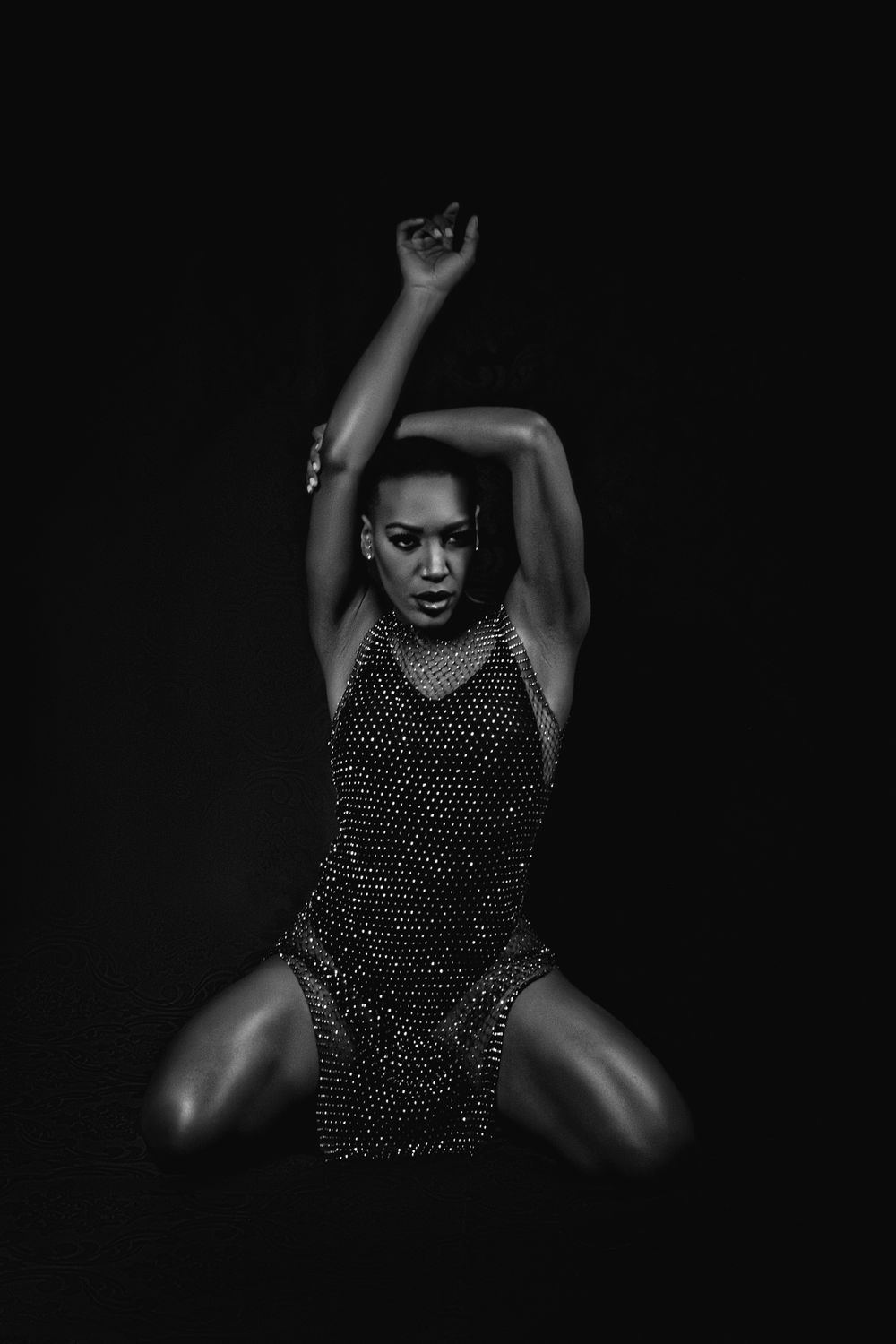 Grayscale Photo of a Woman in Glittery Dress Posing · Free Stock Photo