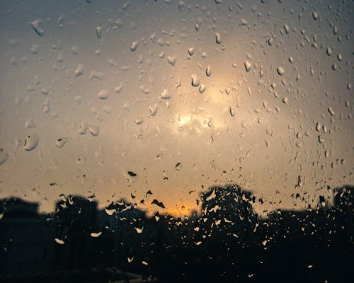 Close-Up Shot of Raindrops on a Glass Window